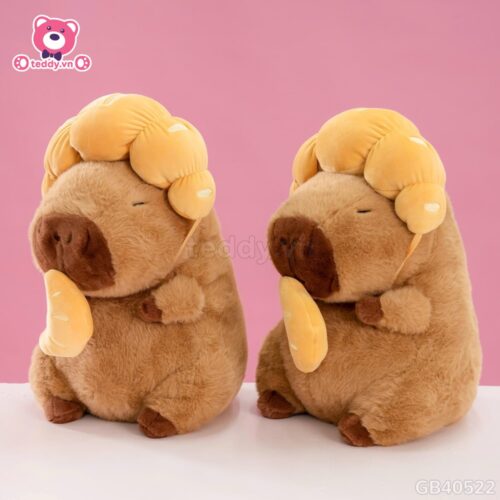 Gấu Bông Capybara Đội Bánh Sừng Bò
