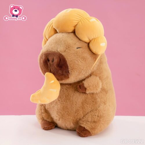 Gấu Bông Capybara Đội Bánh Sừng Bò